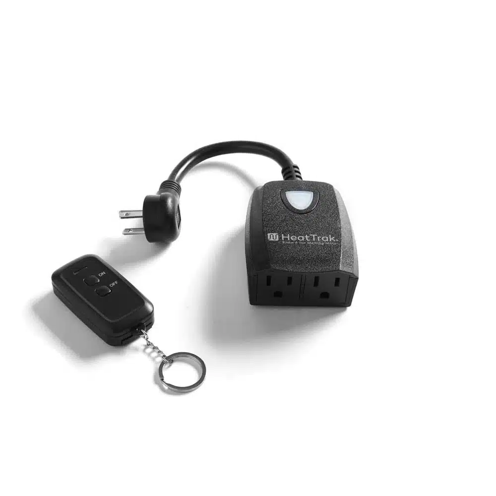 HeatTrak Wireless Two Outlet & Remote Control angled to show both sockets, with the remote beside it