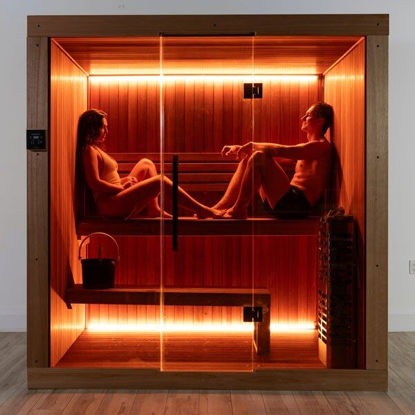 Element Studio indoor sauna front view with two people, optional lighting and heater (sold separately).