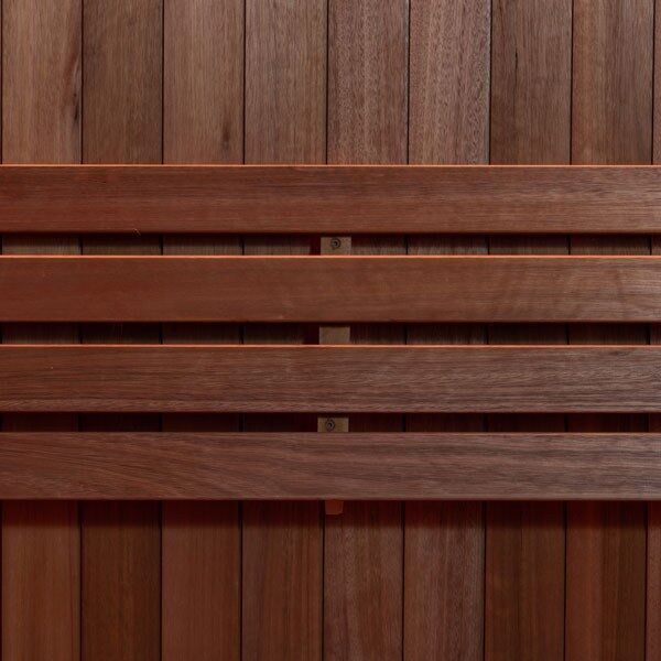 Element Studio indoor sauna close-up of the horizontal wood backrest and vertical wall panels.