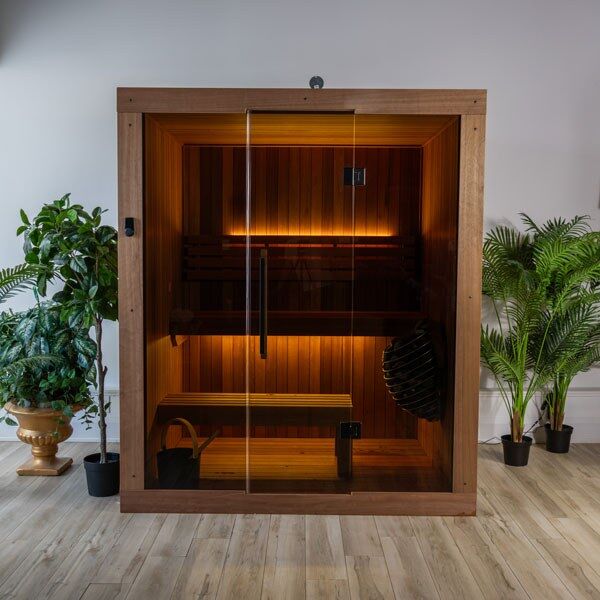 Element Loft indoor sauna viewed from the front, with glass door, tiered benches and optional lighting